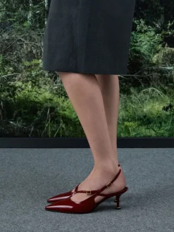 Wynn Patent Asymmetric-Strap Slingback Pumps